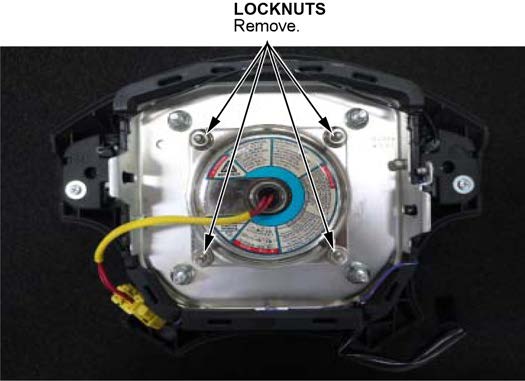 remove the four inflator locknuts